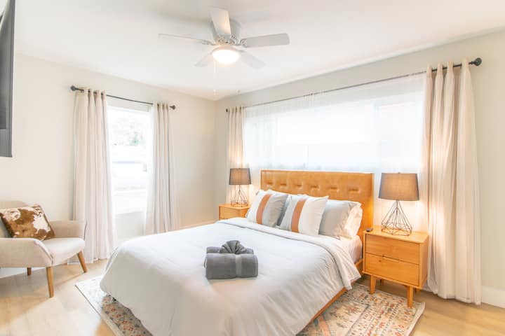 Bedroom 2 includes queen bed and smart TV.