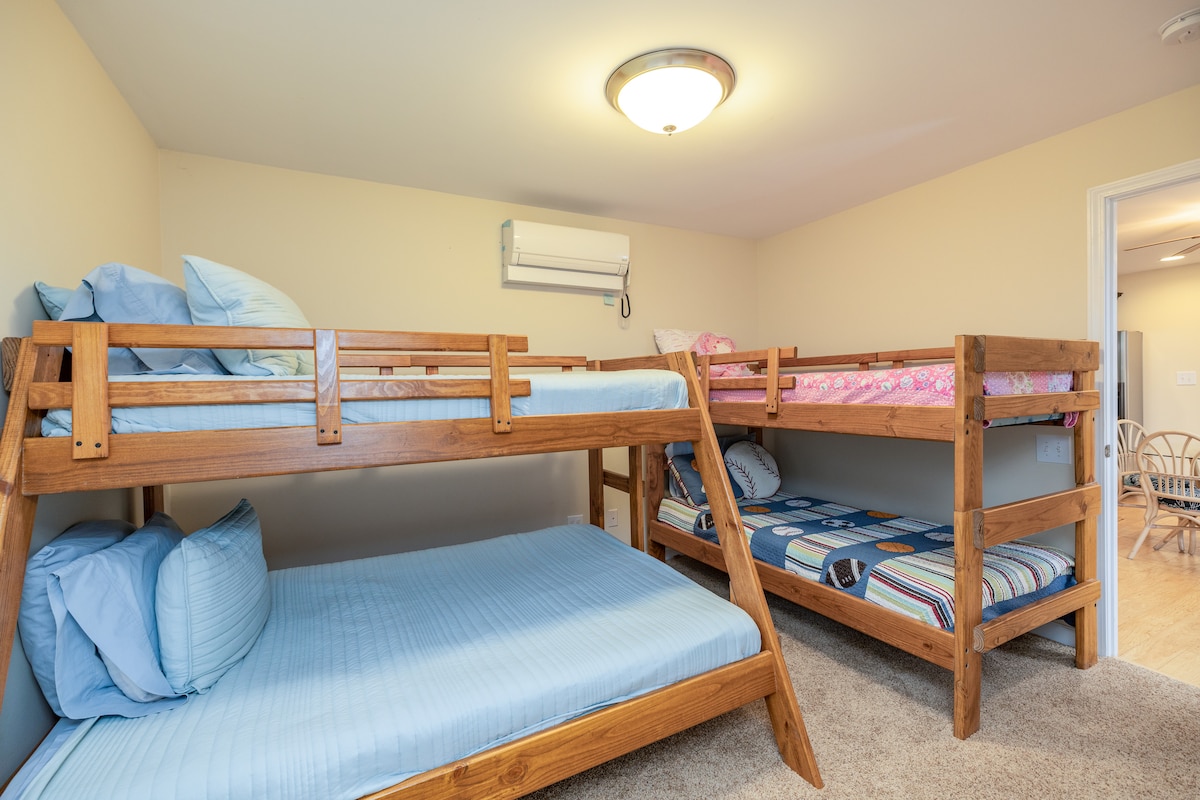 Bunk beds!!  this is a great kids room with a full below twin on one, and twins on the other.