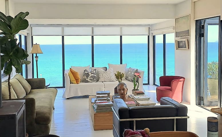 Contemporary beach house with elevated sea views.