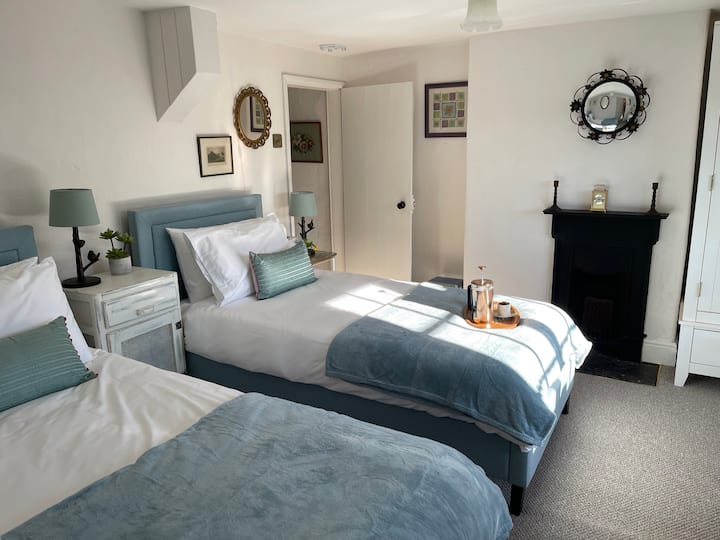 Twin single beds (can be pushed together) with luxury bedlinen.