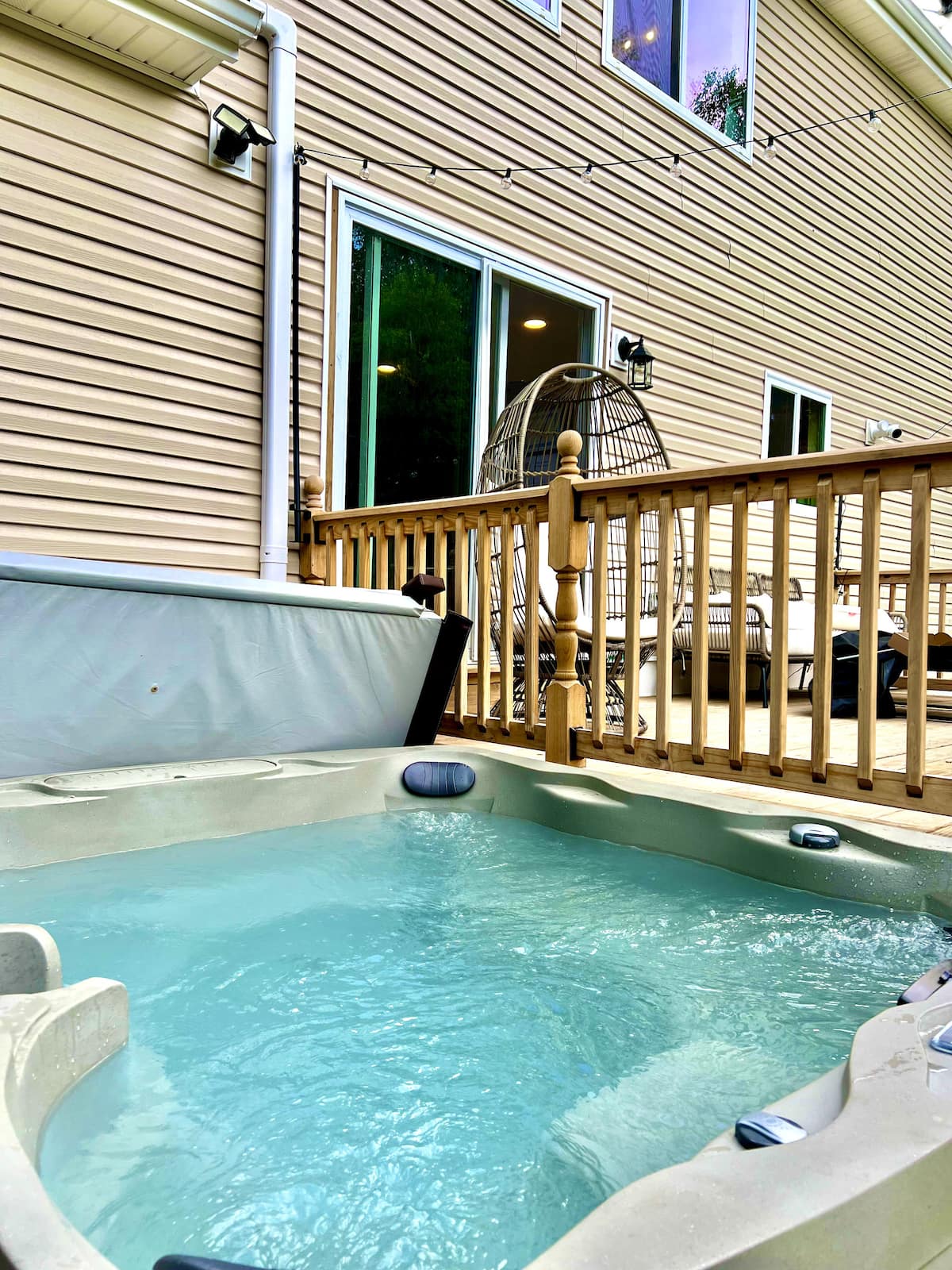 Private hot tub on the deck at Emerald Cottage