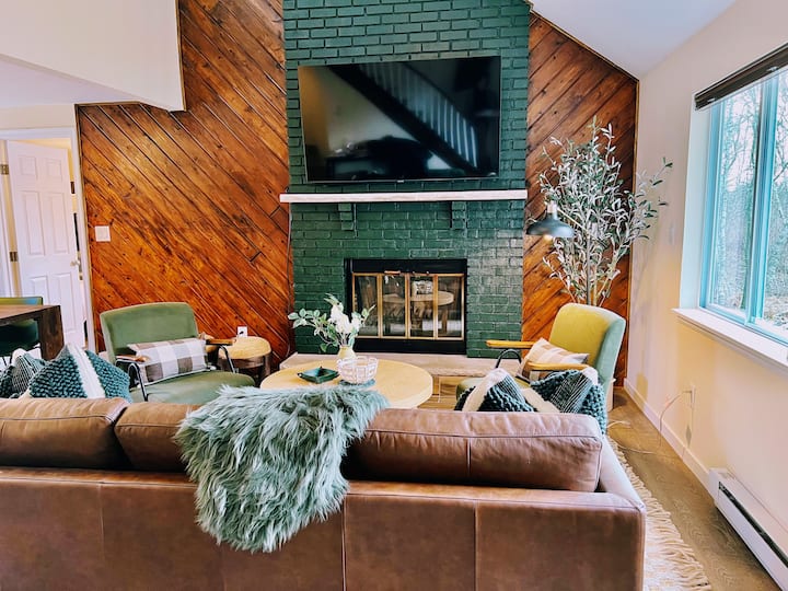 Living room with the wood fireplace and sectional