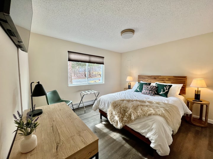 On the ground floor with a queen bed and a smart TV. There is enough room to place a crib in this room.