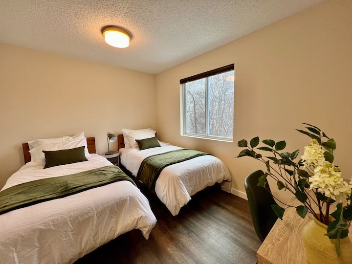 One of the bedroom upstairs with two single beds. Feel free to push the beds together to make it a king size experience.