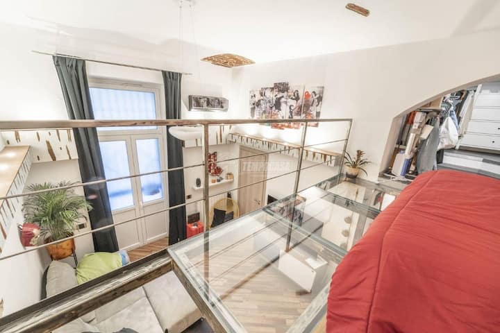 View from the mezzanine of the entire living area and secondary exit overlooking the courtyard
