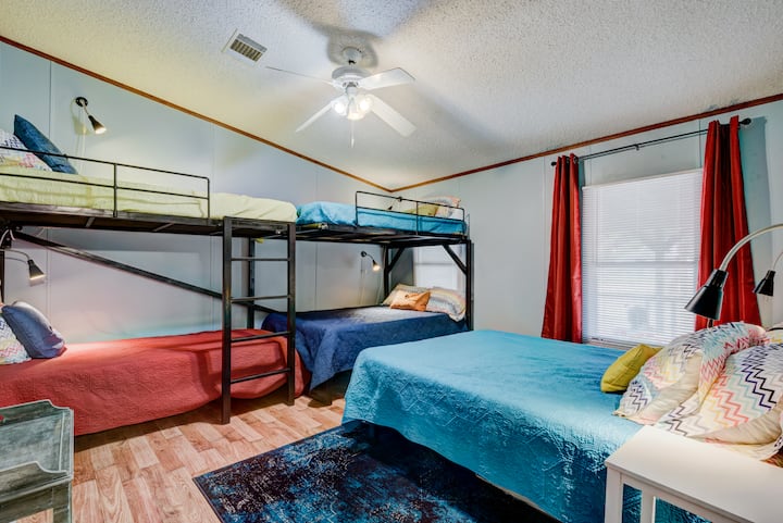 Primary bedroom can sleep 8!  With a queen, 2 full beds and 2 twins! This room has an en suite.