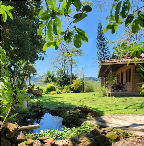 Ranch with a swimming pool and river in front of the gate.