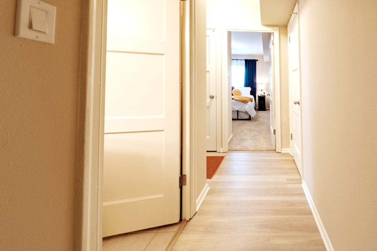Entrance hallway leading to bedroom and bathroom.