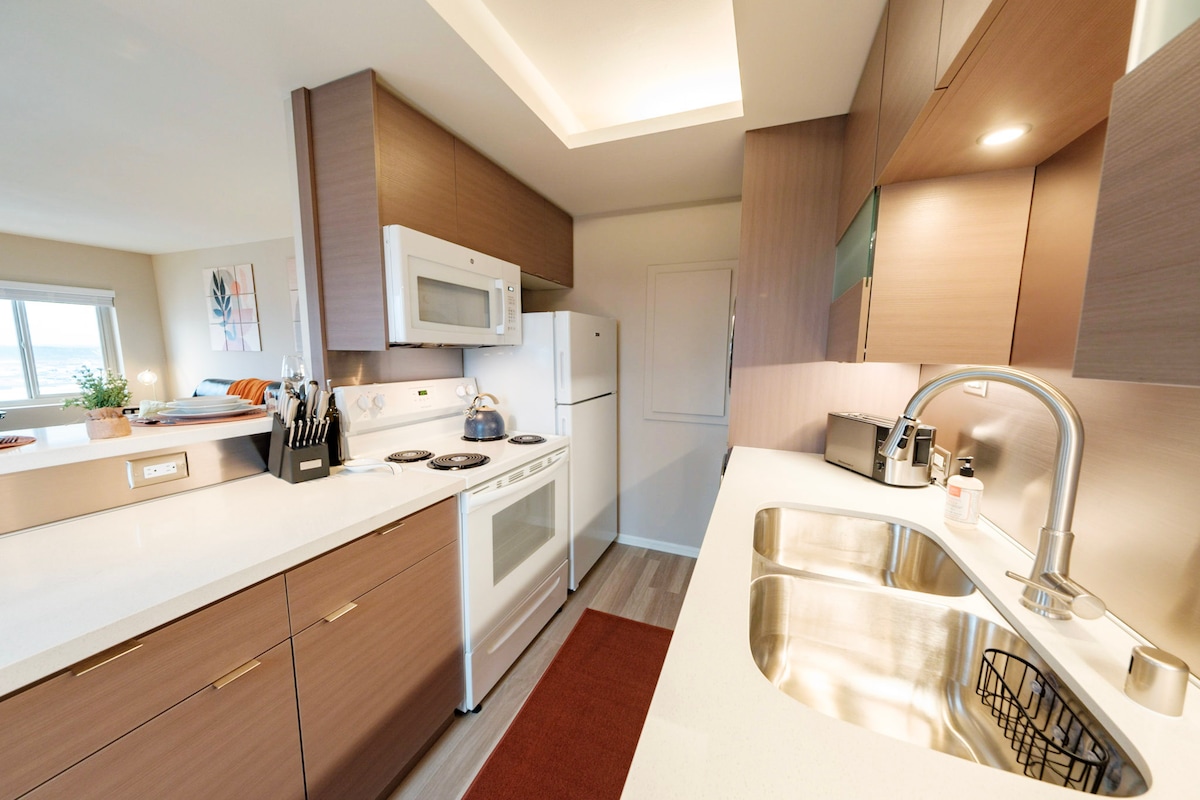 Plenty of natural light in your brand-new open kitchen and easy for you to carry on a conversation with guest in the living room while you're whipping up a fantastic meal in your full equipped kitchen.