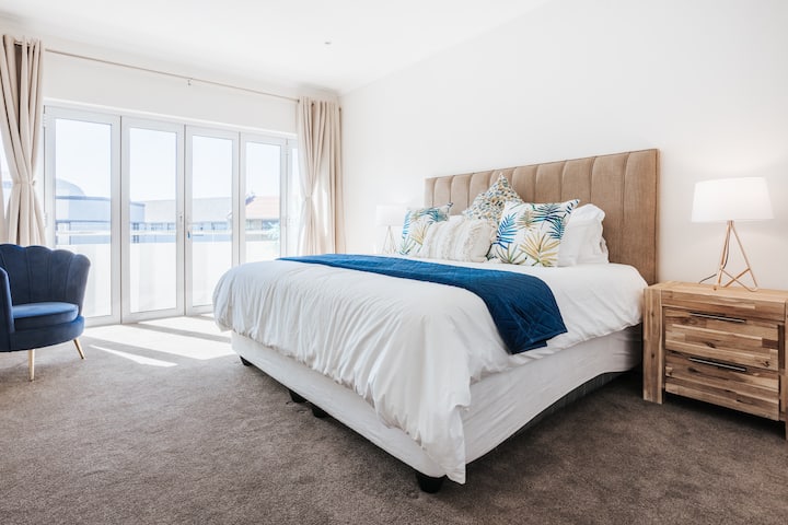 The primary bedroom with king size bed and soft 100% cotton linen.