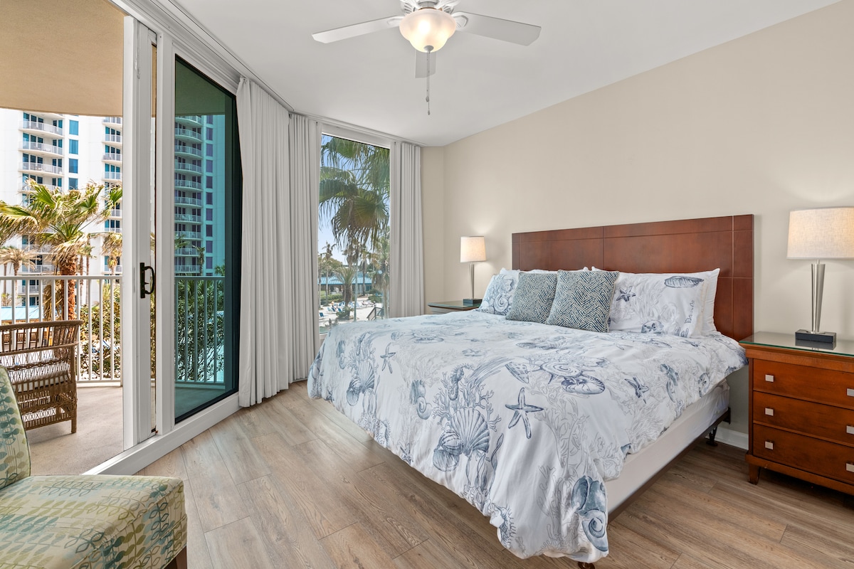 Spacious and beautifully decorated Master suite with Gulf and Lagoon pool views, patio access. 
