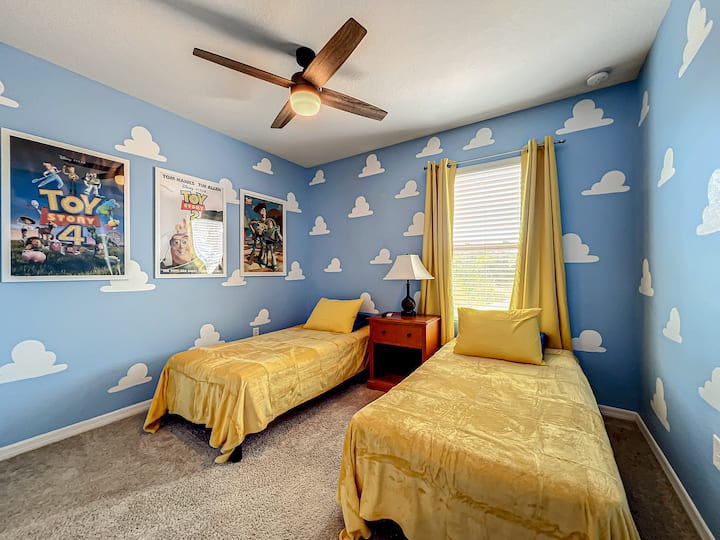 Twin beds in a room filled with Toy Story charm—ideal for siblings or friends.