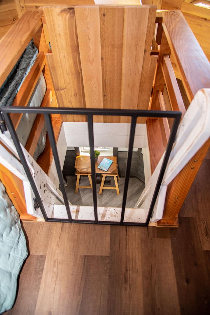 Ladder to 2nd floor with gate and hatch. 