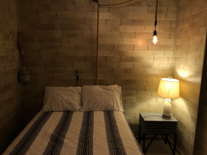 Bedroom with a Cabin Feel
Fullsize Bed and dresser for clothes.