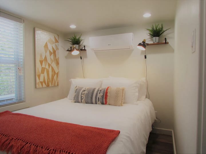 Sink into the plush queen size bed in the downstairs bedroom and enjoy a tree lined view from your window.  We have reading lamps for the book worms and your own air conditioner for your perfect sleeping temp