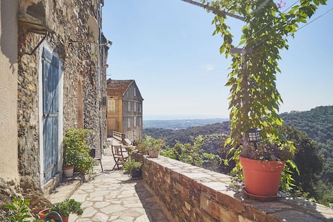 Stone house in the heart of a village