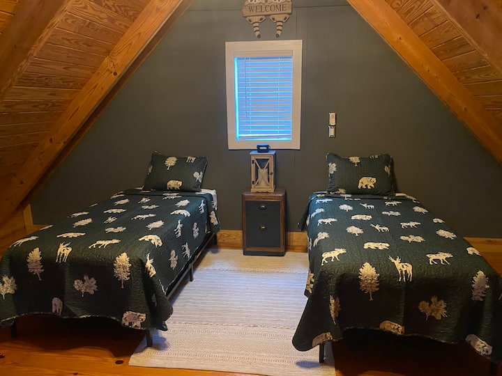 Twin beds make the loft space a fun getaway for the kiddos or provide extra sleeping space for your girls' weekend getaway!