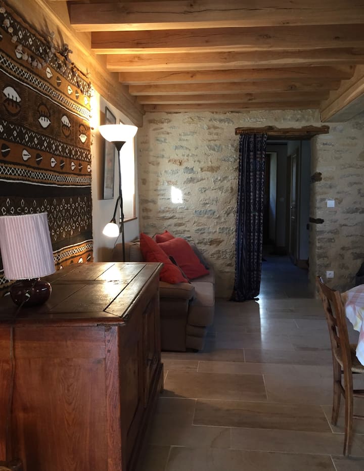Living room on the sitting area side. At the back the entrance hallway.