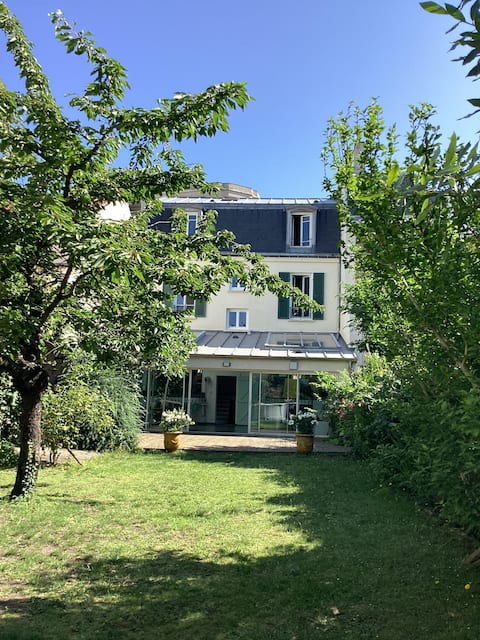 family home with large wooded garden