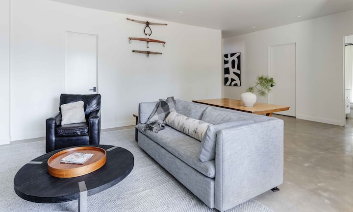 Cozy downstairs den area with large TV,  downstairs bath and direct access to a second patio. 
