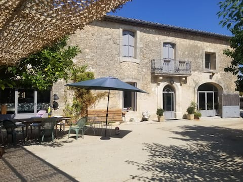 Character house with pool between scrubland and sea