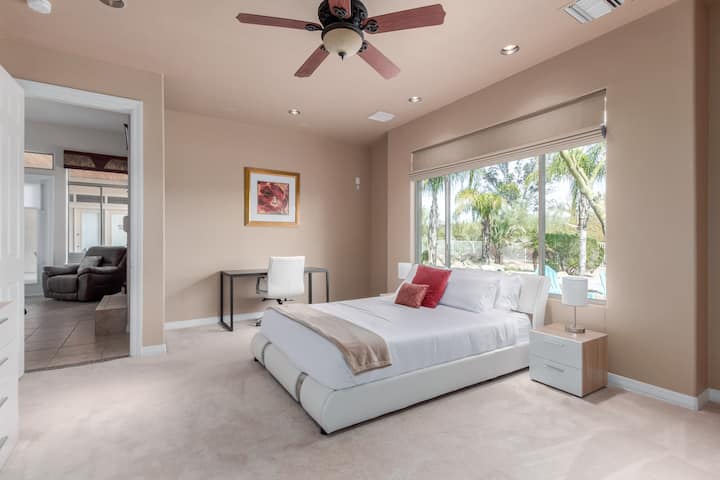 Bedroom 2- Queen memory foam mattress with premium linens and 32inch smart HDTV, desk and chair for a comfortable remote workspace. 