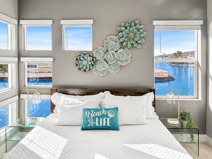 King Bedroom with lake views, reach in closet and ensuite bathroom with shower