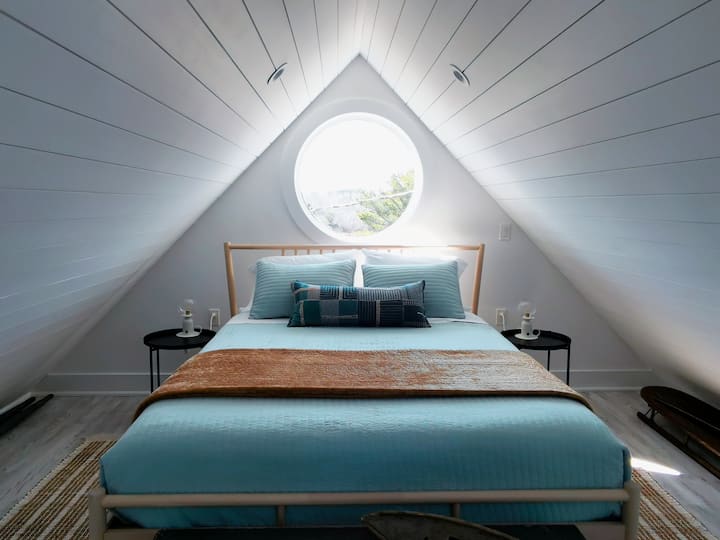This loft bedroom is calling your name... And the view from the opening skylight is incredible!