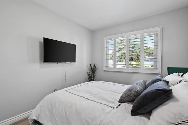 Bedroom #2 with our king-size bed & LG Smart TV
