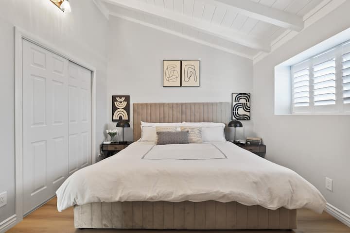 Main bedroom of our house with a king bed and a LG smart TV you can relax in