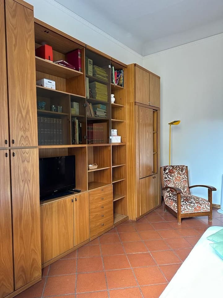Here is the living room, to relax after a long day. It accomodates two extra foldaway twin beds, if needed.