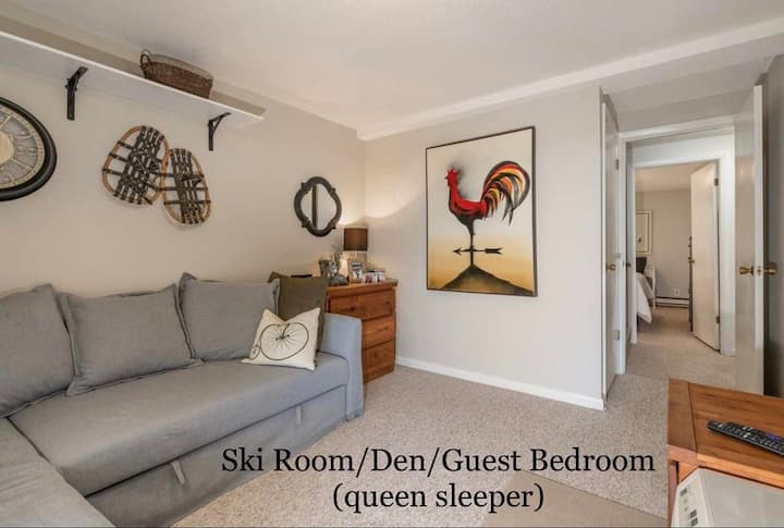 Plenty of hooks and boot trays for all your ski gear. This room also features another smart TV.