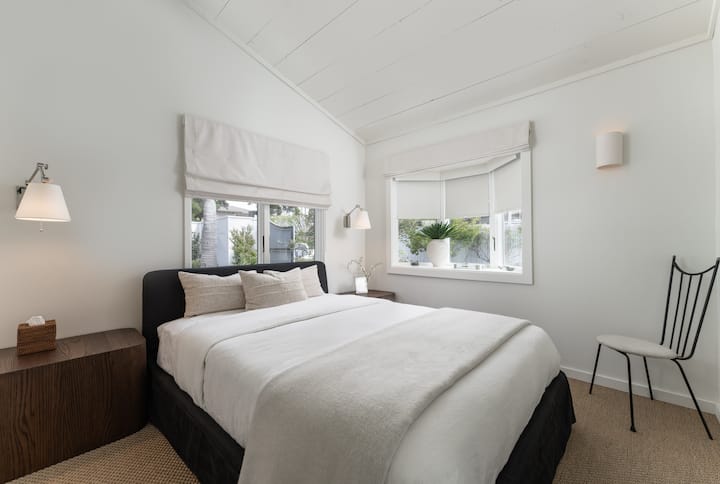 Bedroom with Queen bed, closet, black out shades, & own bath