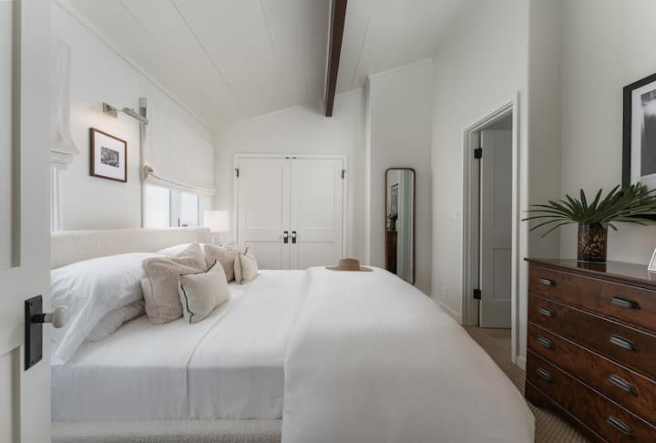 Primary bedroom with King bed, closet, black out shades, & own bath
