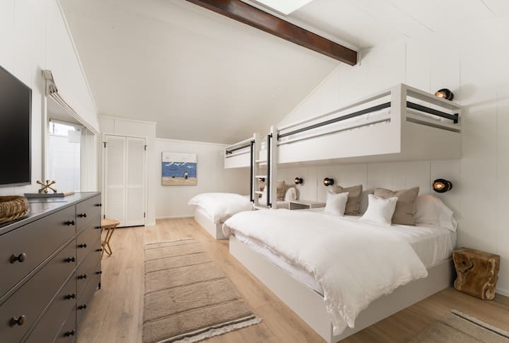 Large bunk room with 2 king beds & 2 twin beds. Black out shades, TV, own bathroom 