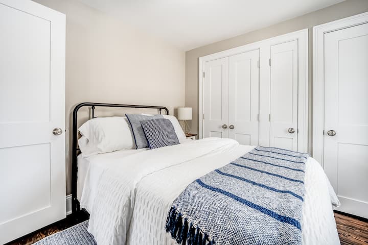 Bedroom 1 has a full-size bed and is located on the 1st floor adjacent to the full bathroom.