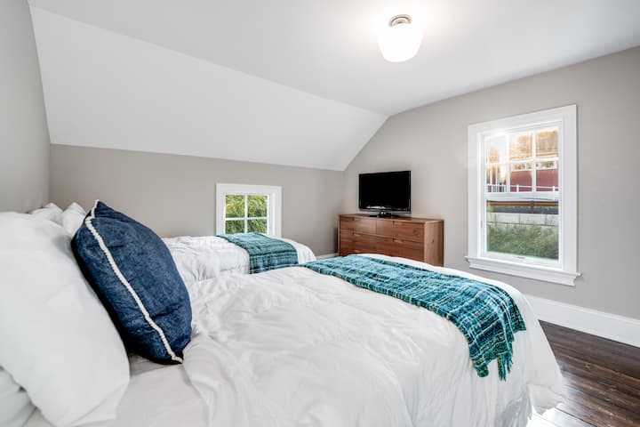 Bedroom 3 has a pair of twin size beds and is located on the 2nd floor and has views of the recently restored historic train station across the street.