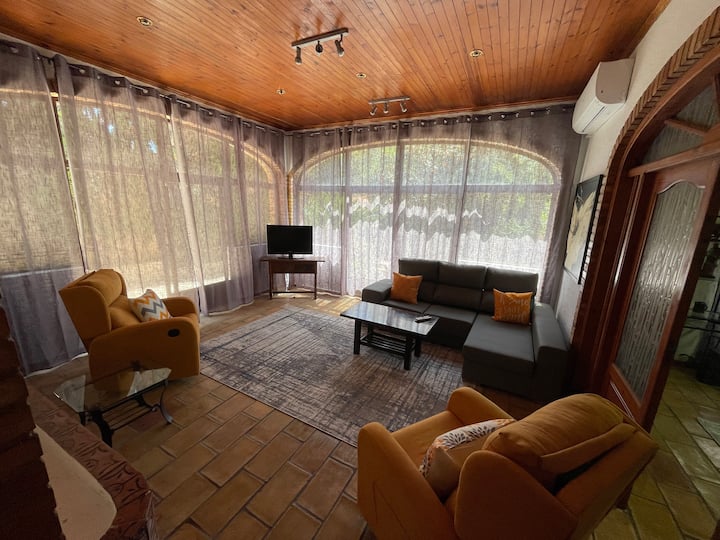 Downstairs lounge with garden view and 2 sets of sliding doors.
IMPORTANT NOTE: when the group size is 14 people this lounge becomes an extra bedroom, by placing 2 extra beds