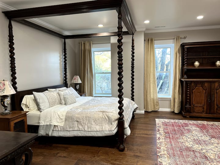 Room #1: Aphrodite 
Largest Single Bedroom featuring a grand antique four poster, hand carved wooden bed frame, with a California king sized mattress;
Original 19th Century closet and wardrobe; Views of the Ceremony Lawn and front of the Estate