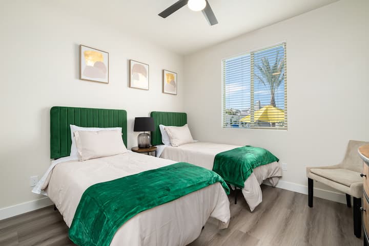 Downstairs bedroom #2: features two twin beds and a television