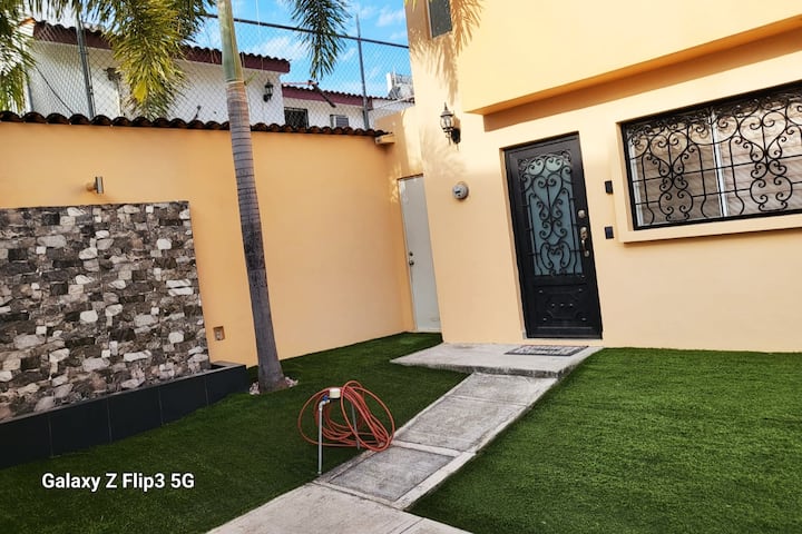 House in a residential development with a pool. PV