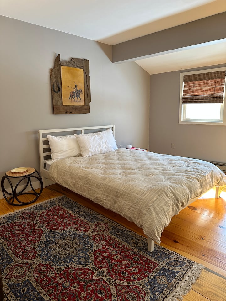 2nd floor bedroom featuring a queen bed 