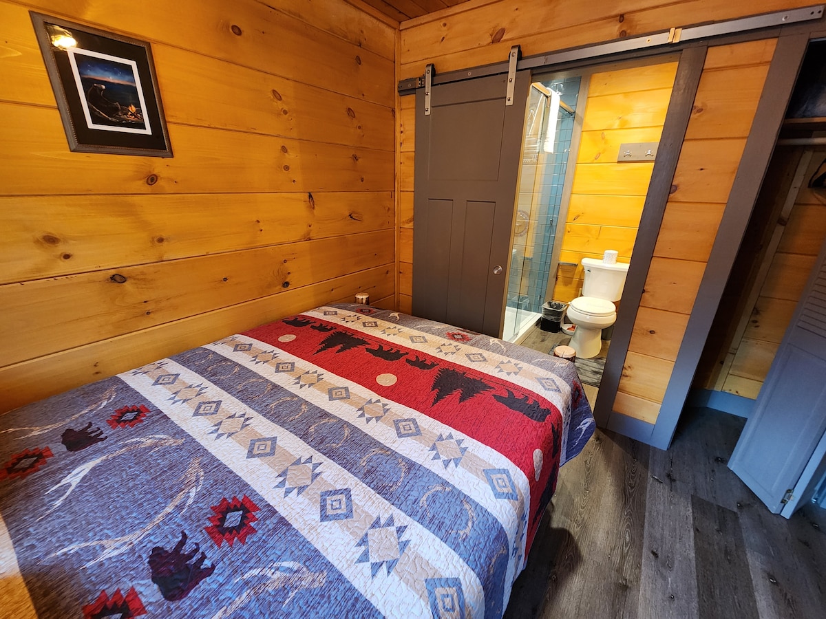 Master BR, main level, attached full bath with walk-in shower, Queen Bed,  closet, TV