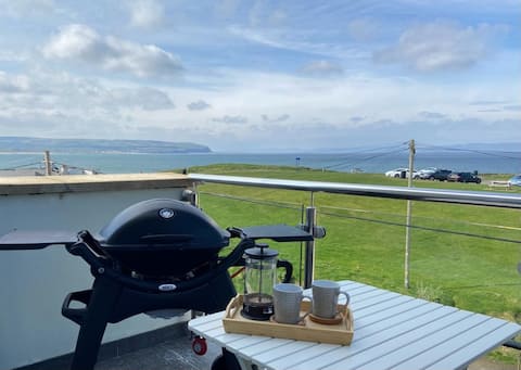 Top performing Airbnb: Panoramic Sea Views Balcony 2 minute walk to prom in Portstewart