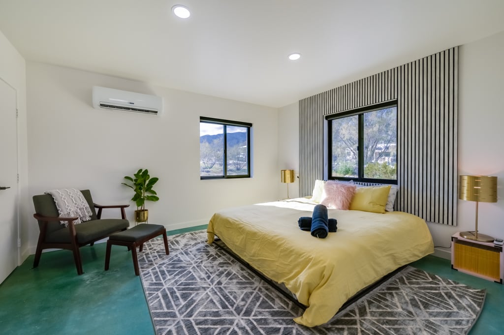 Bedroom with private lounger and king sized bed