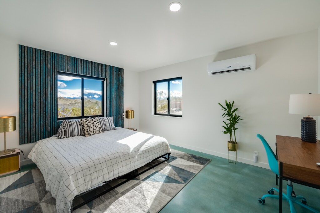 Bedroom with private desk space and king sized bed