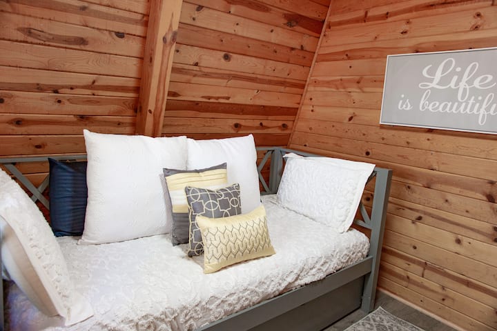 Downstairs bedroom with pull-out twin mattress underneath the main bed.