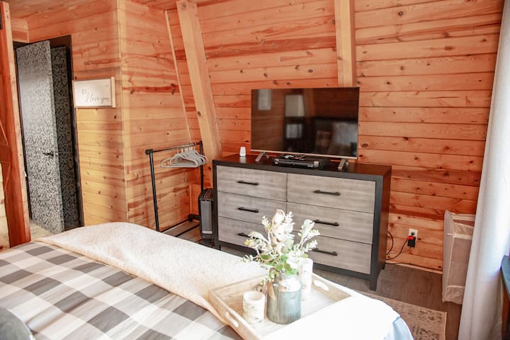 This is the Master Bedroom with flatscreen TV and king bed.  In the summer a portable A/C is provided.