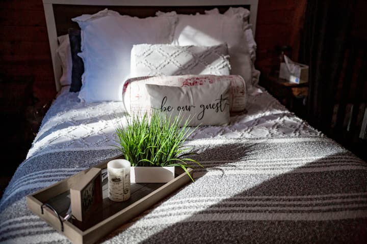 The queen bed in the loft bedroom upstairs.