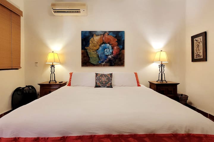 The downstairs master suite boasts a comfortable king bed, privacy/blackout blinds, a separate AC unit for the ultimate relaxation.